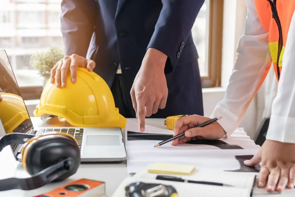 builders-discussing-documents-at-table